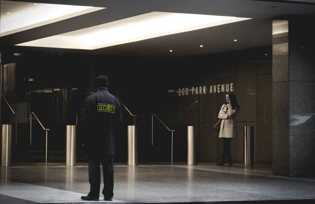 Uniformed security guard on duty in a building lobby