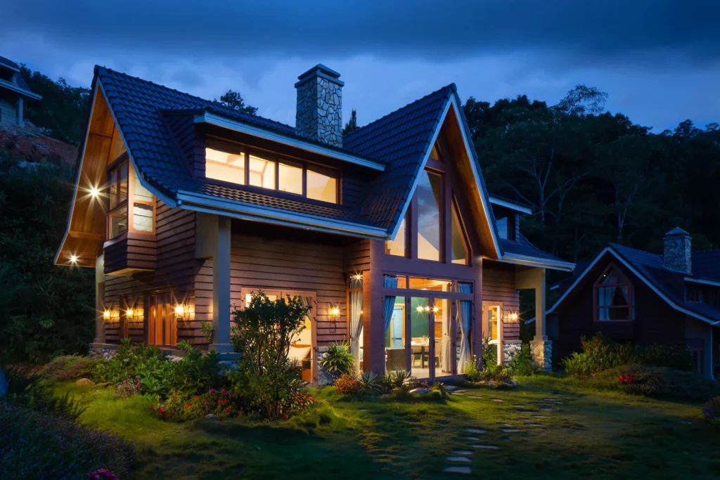 Family home lit up at night