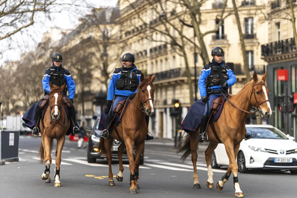 Mounted patrol unit on horseback in an urban street